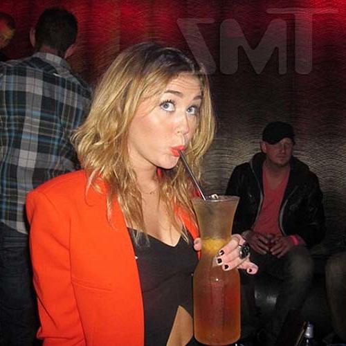 16P Miley Cyrus licking a huge black penis cake at some party
