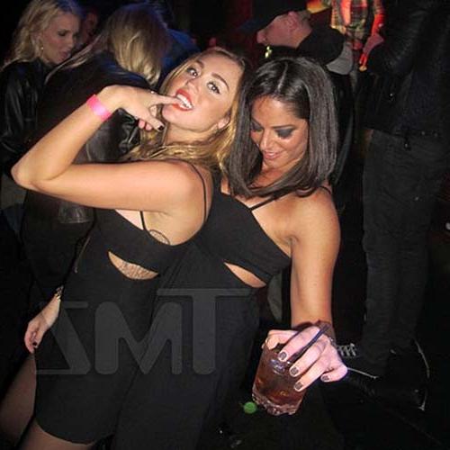 16P Miley Cyrus licking a huge black penis cake at some party
