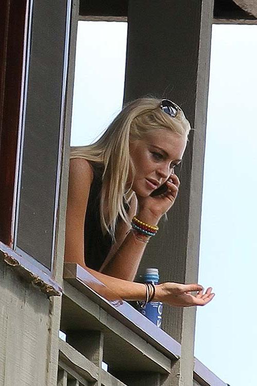 16P Lindsay Lohan spreading her sexy legs at the balconcy of hotel