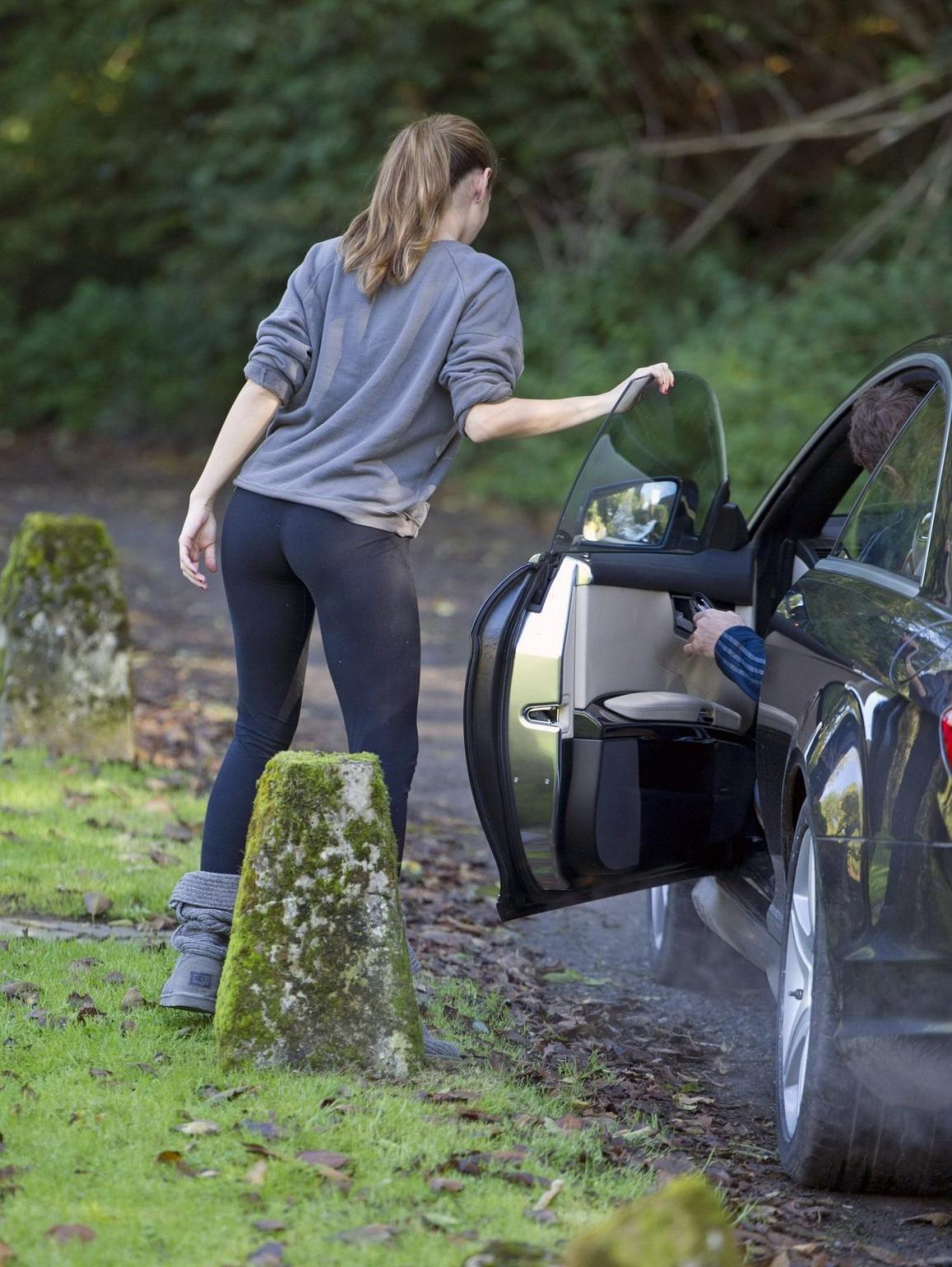 16P Kelly Brook showing off her ass in tights outside her home in London