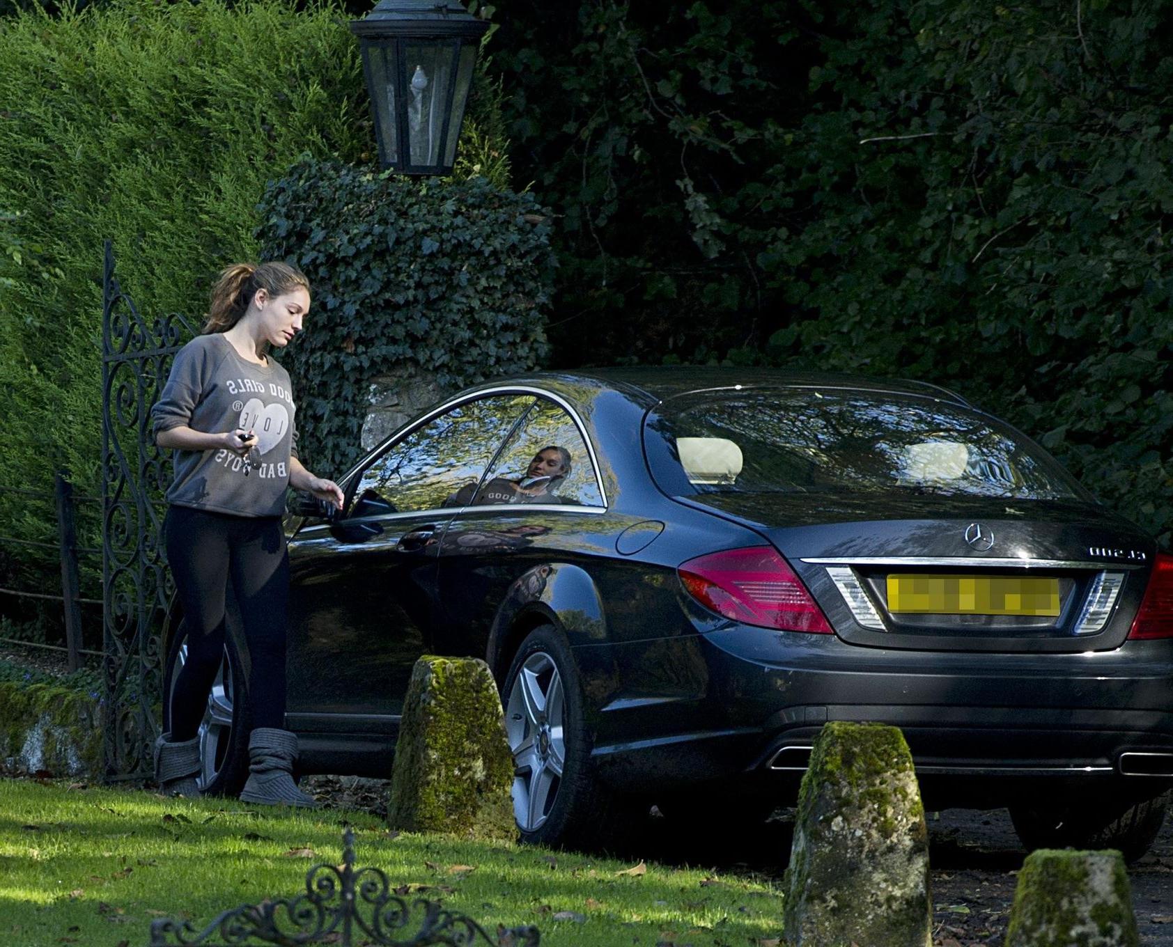 16P Kelly Brook showing off her ass in tights outside her home in London