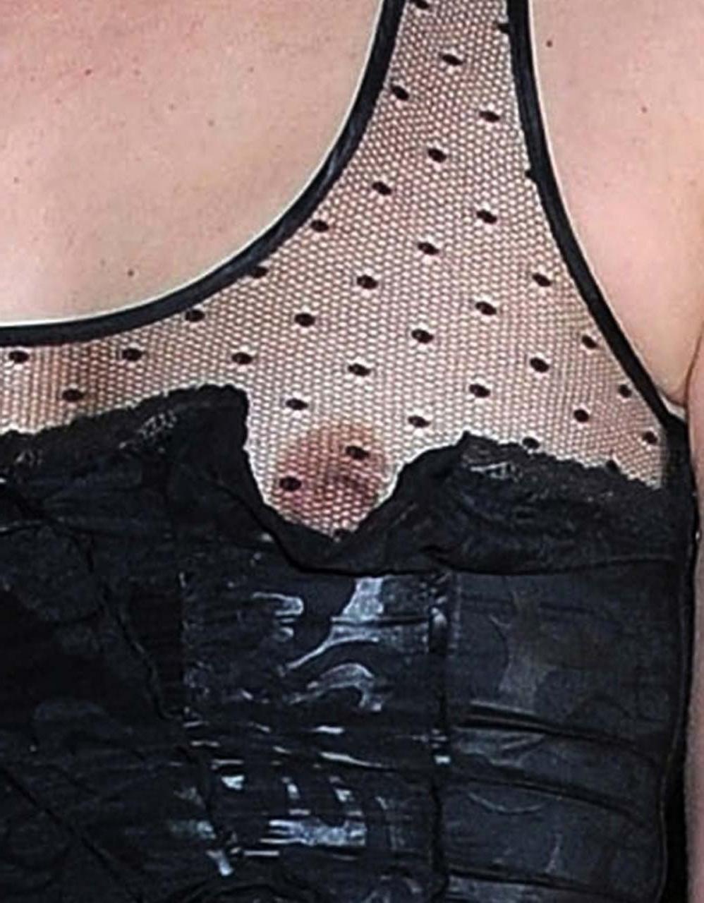16P Milla Jovovich flashing her nipple in see thru dress and upskirt in car paparazz