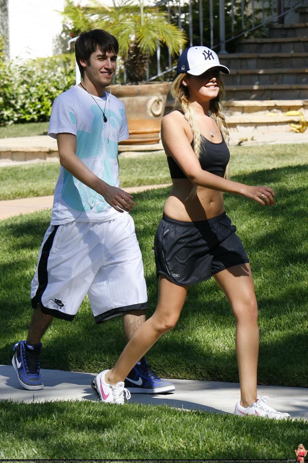 16P Ashley Tisdale shows off her sexy body while jogging in belly shirt and shorts