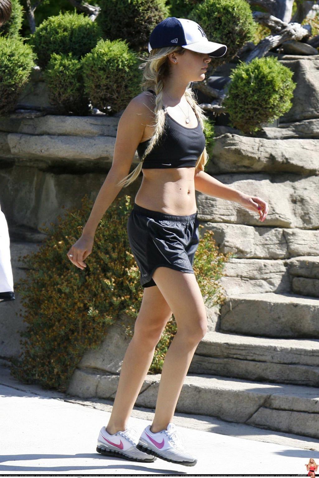 16P Ashley Tisdale shows off her sexy body while jogging in belly shirt and shorts