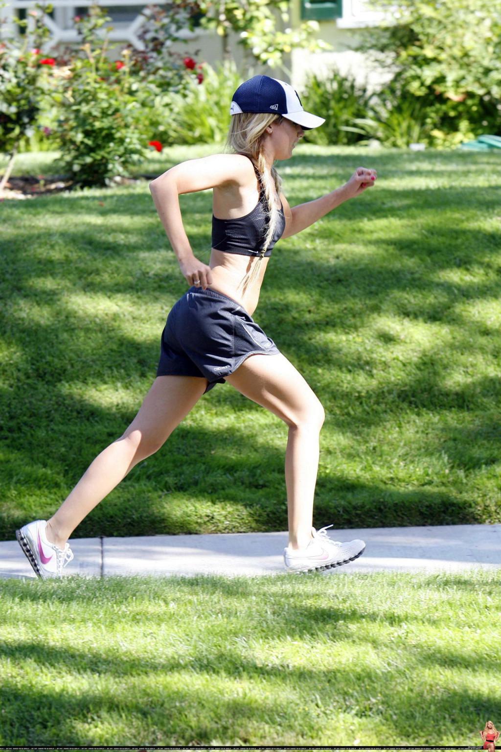 16P Ashley Tisdale shows off her sexy body while jogging in belly shirt and shorts