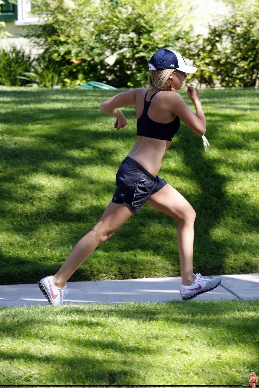 16P Ashley Tisdale shows off her sexy body while jogging in belly shirt and shorts