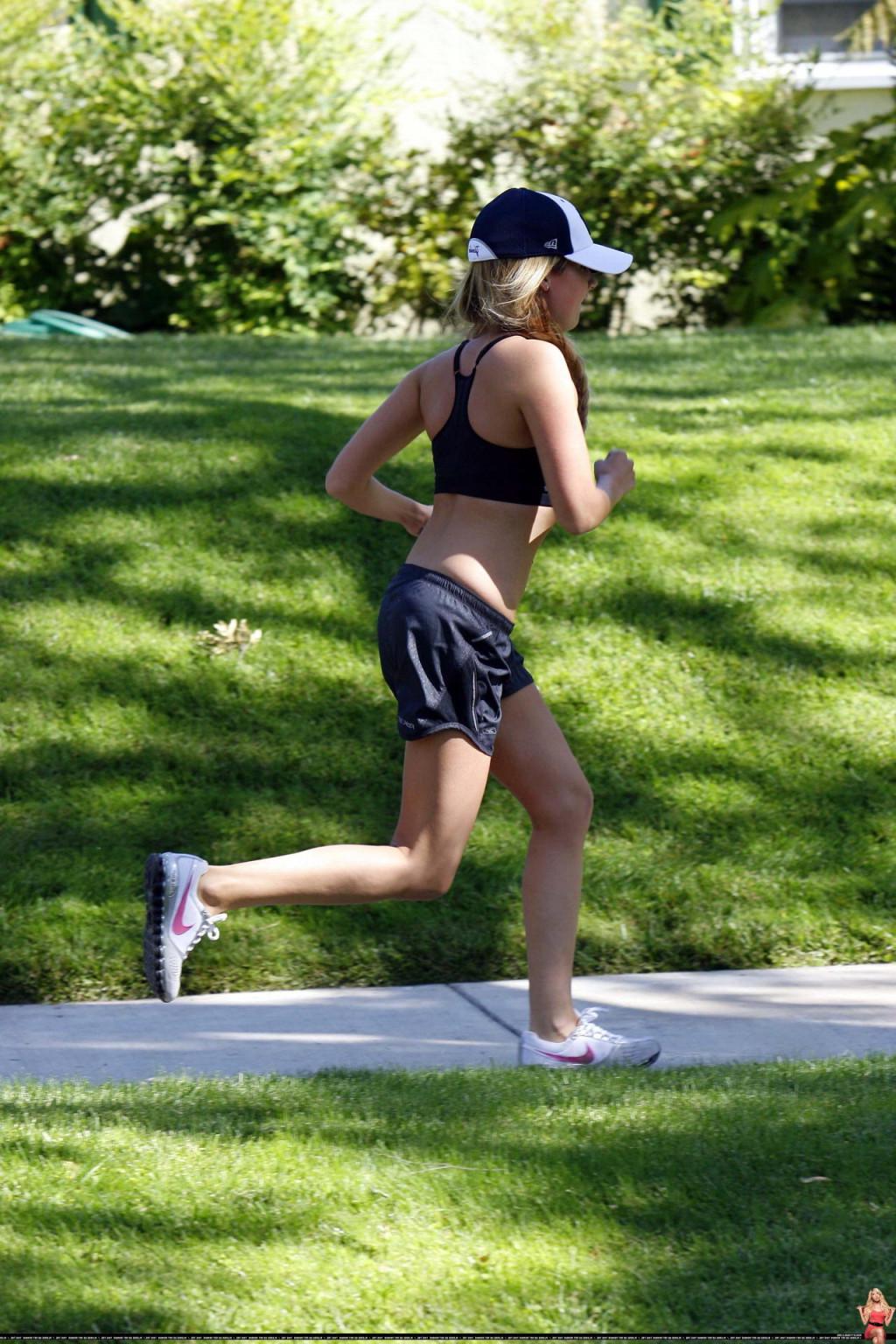 16P Ashley Tisdale shows off her sexy body while jogging in belly shirt and shorts