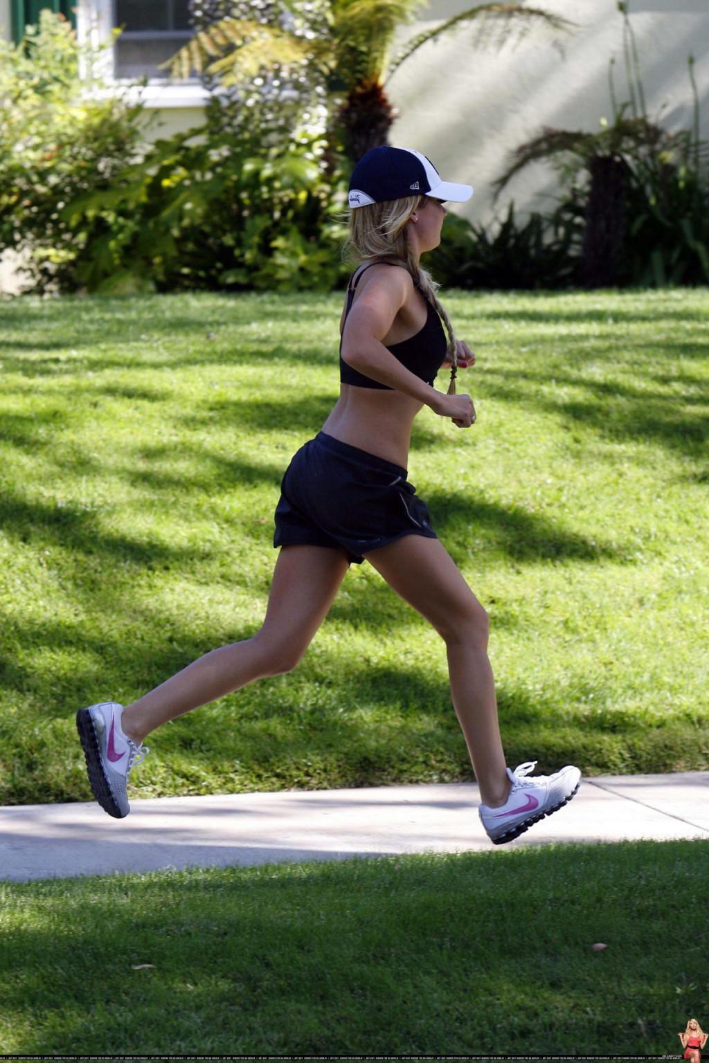 16P Ashley Tisdale shows off her sexy body while jogging in belly shirt and shorts