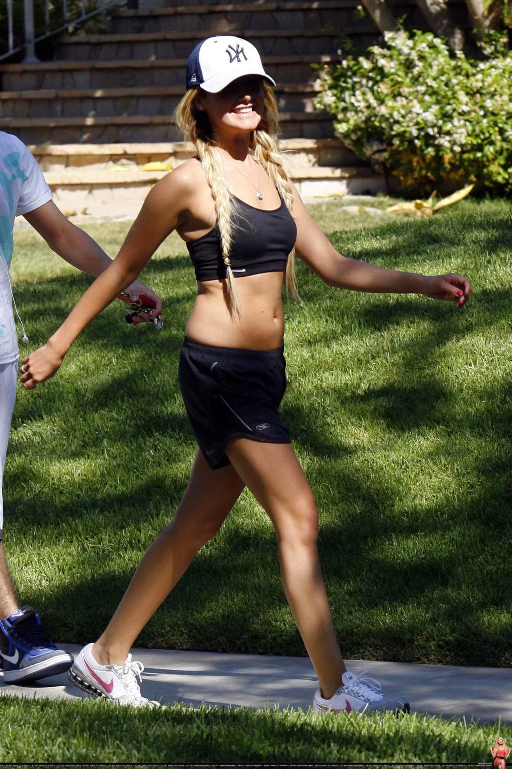 16P Ashley Tisdale shows off her sexy body while jogging in belly shirt and shorts