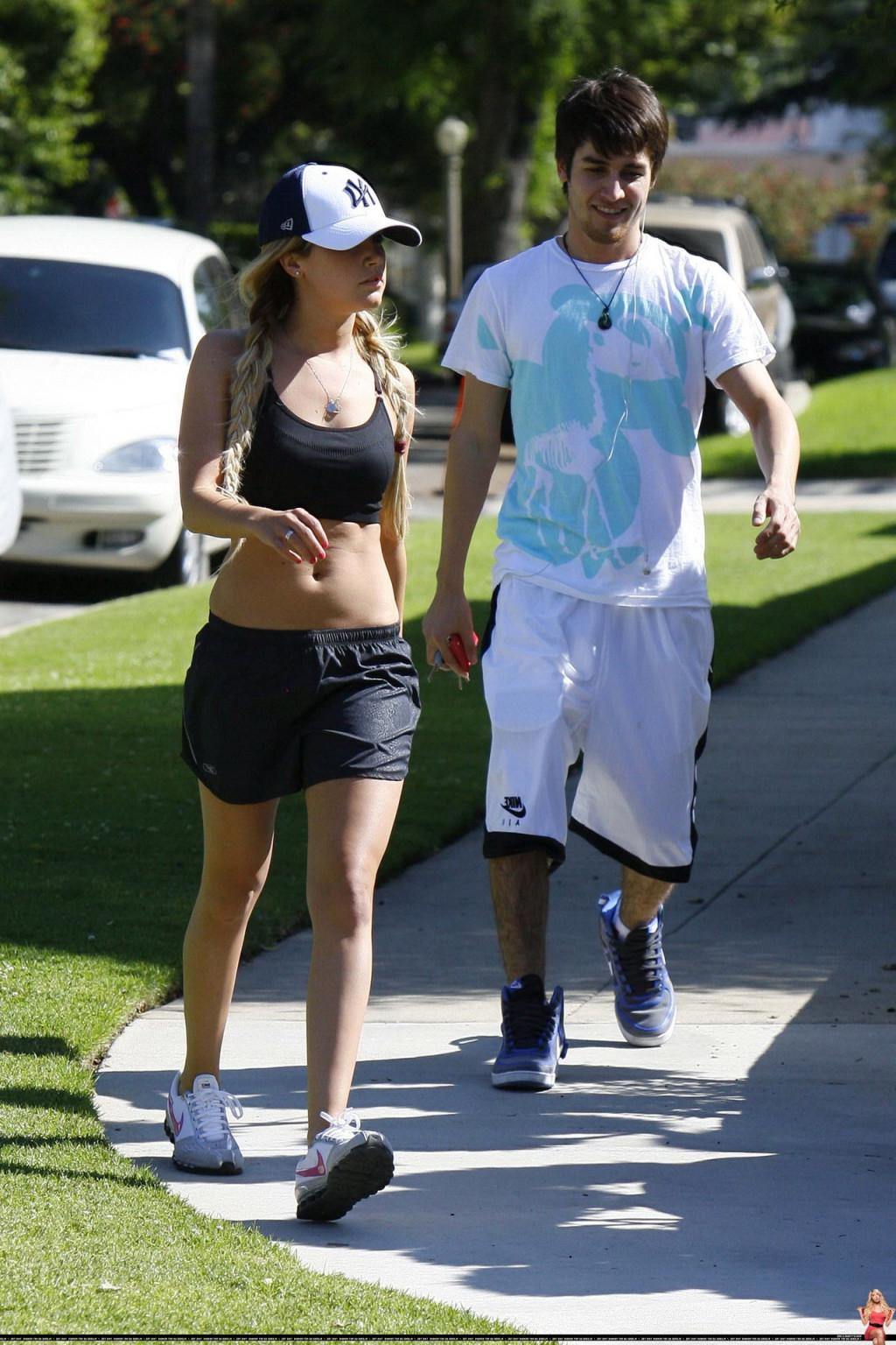 16P Ashley Tisdale shows off her sexy body while jogging in belly shirt and shorts