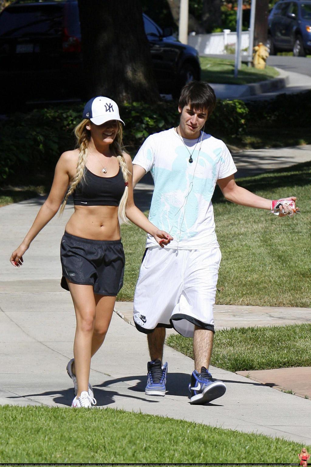 16P Ashley Tisdale shows off her sexy body while jogging in belly shirt and shorts