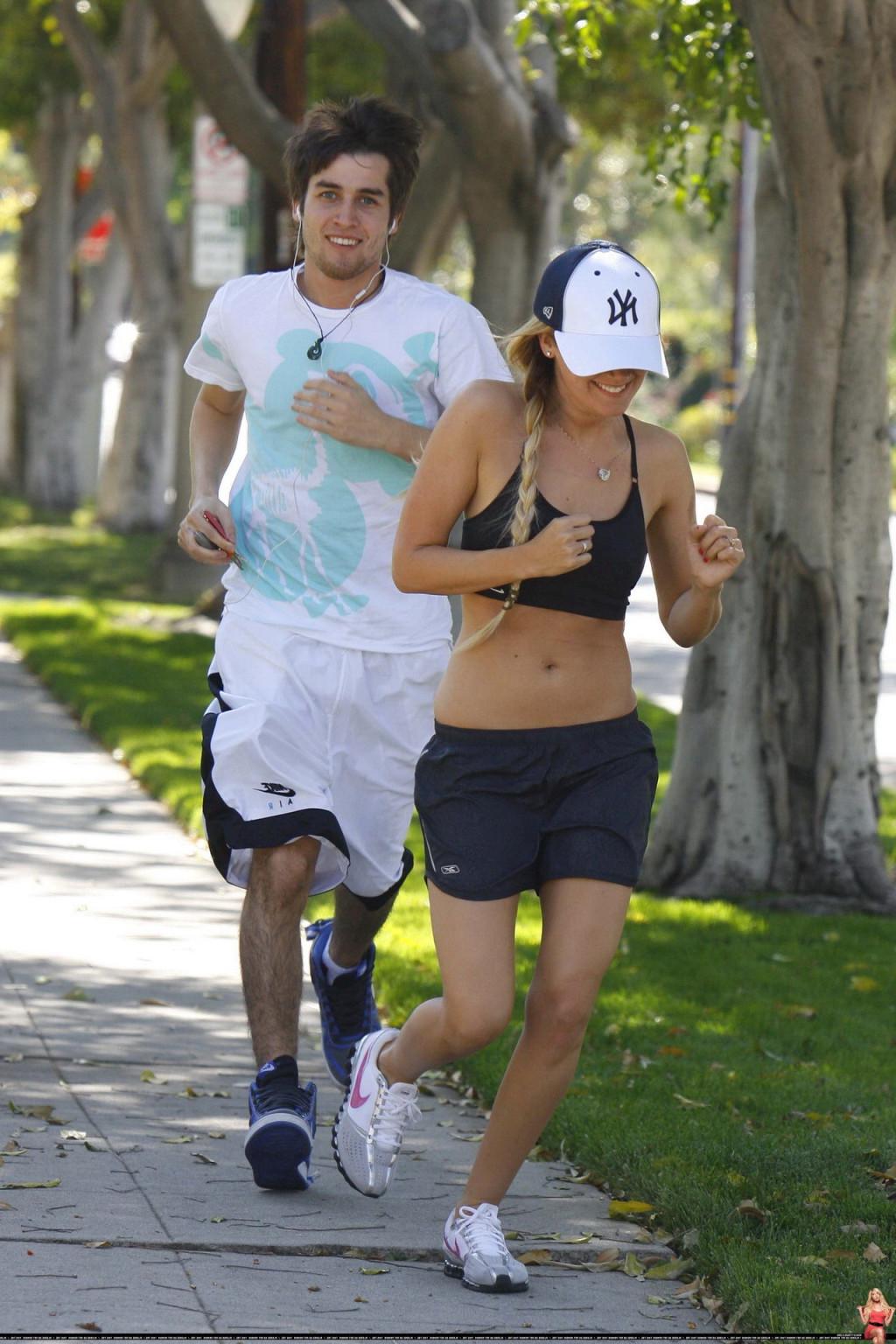 16P Ashley Tisdale shows off her sexy body while jogging in belly shirt and shorts
