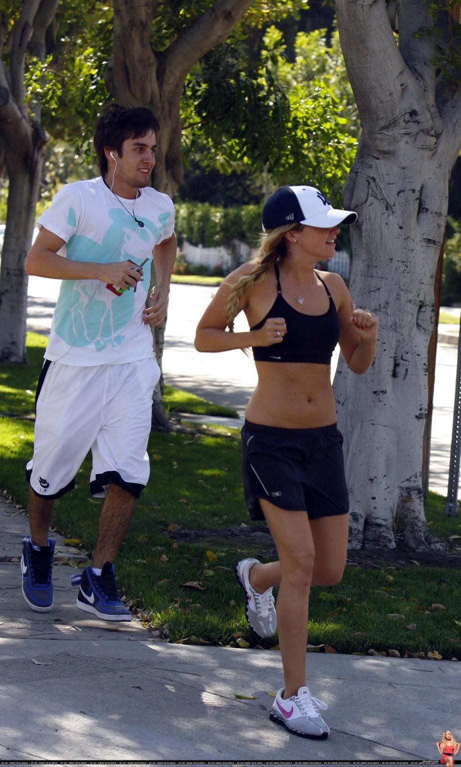 16P Ashley Tisdale shows off her sexy body while jogging in belly shirt and shorts