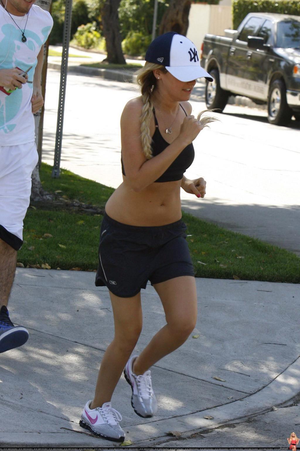 16P Ashley Tisdale shows off her sexy body while jogging in belly shirt and shorts