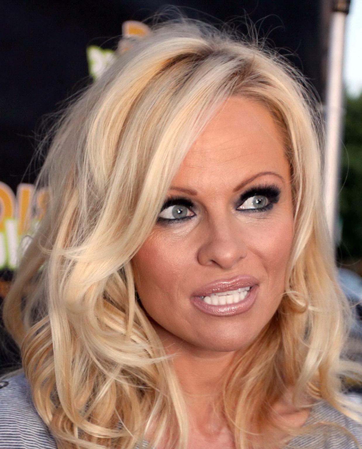 16P Pamela Anderson leggy in mini dress at 'The Big Bluff' online game launch
