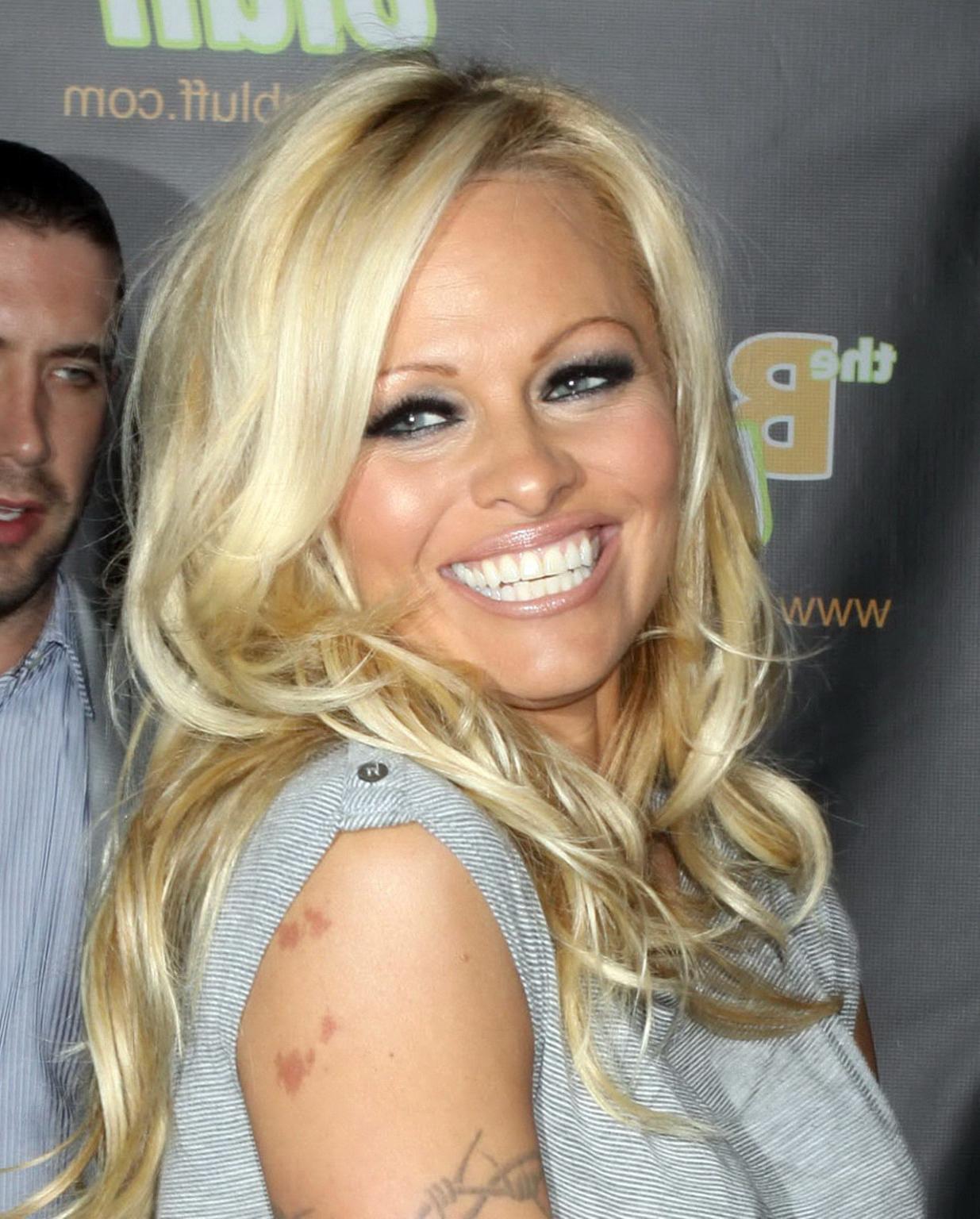 16P Pamela Anderson leggy in mini dress at 'The Big Bluff' online game launch