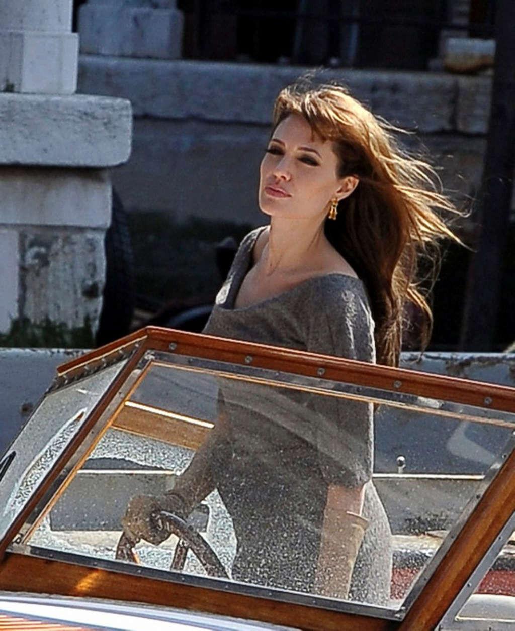 10P Angelina Jolie caught in upskirt moment while exit from car and showing her nice