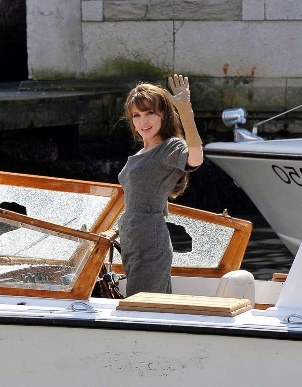 10P Angelina Jolie caught in upskirt moment while exit from car and showing her nice