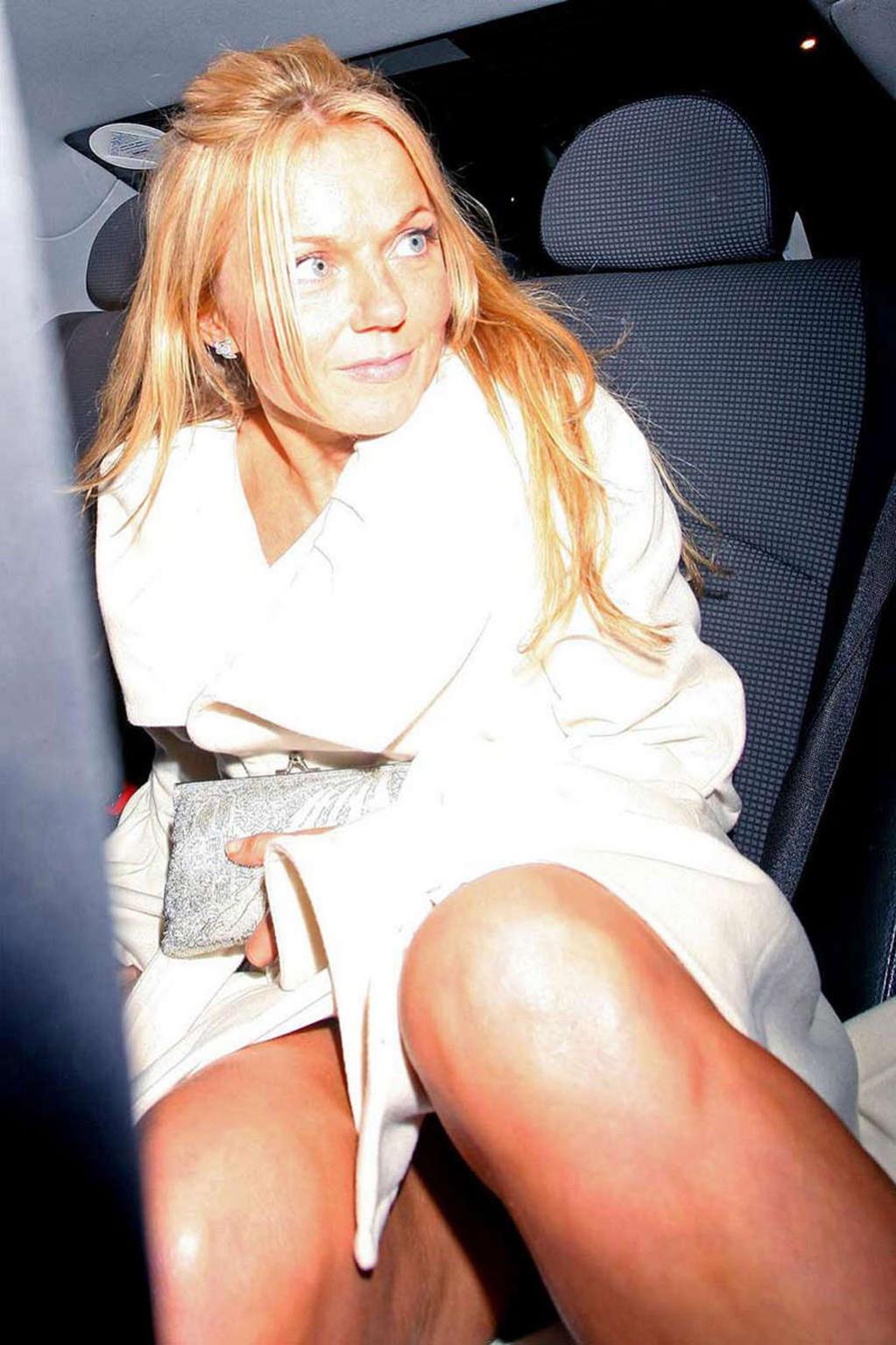 10P Geri Halliwell exposing her nice big tits and almost upskirt in car