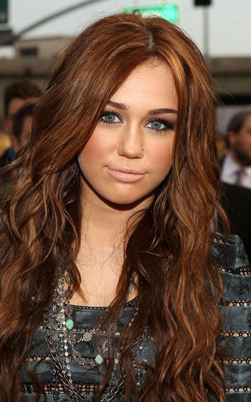 10P Miley Cyrus very leggy in mini skirt and upskirt in car paparazzi pictures