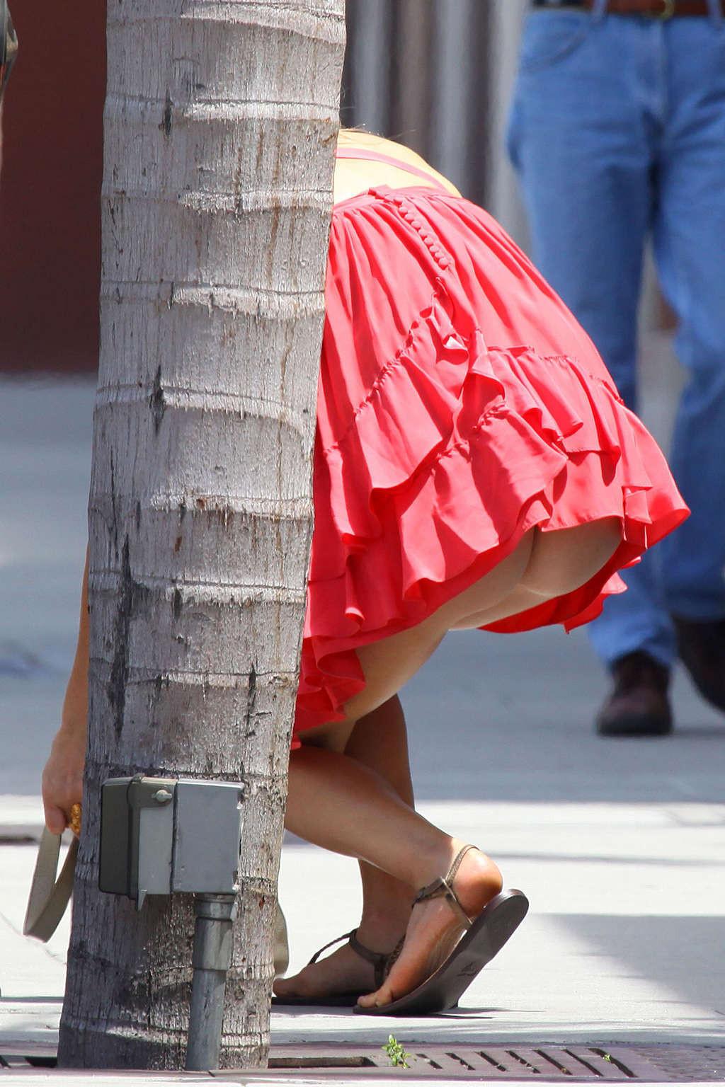 10P Ali Larter upskirt in car paparazzi pictures and very leggy in mini skirt