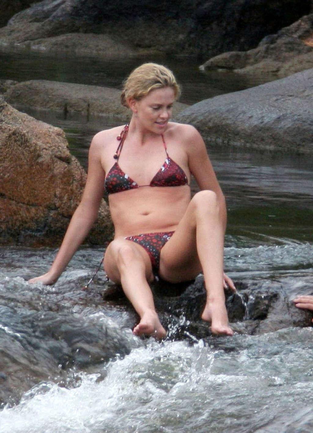 16P Charlize Theron showing her sexy underwear while she getting out of the car