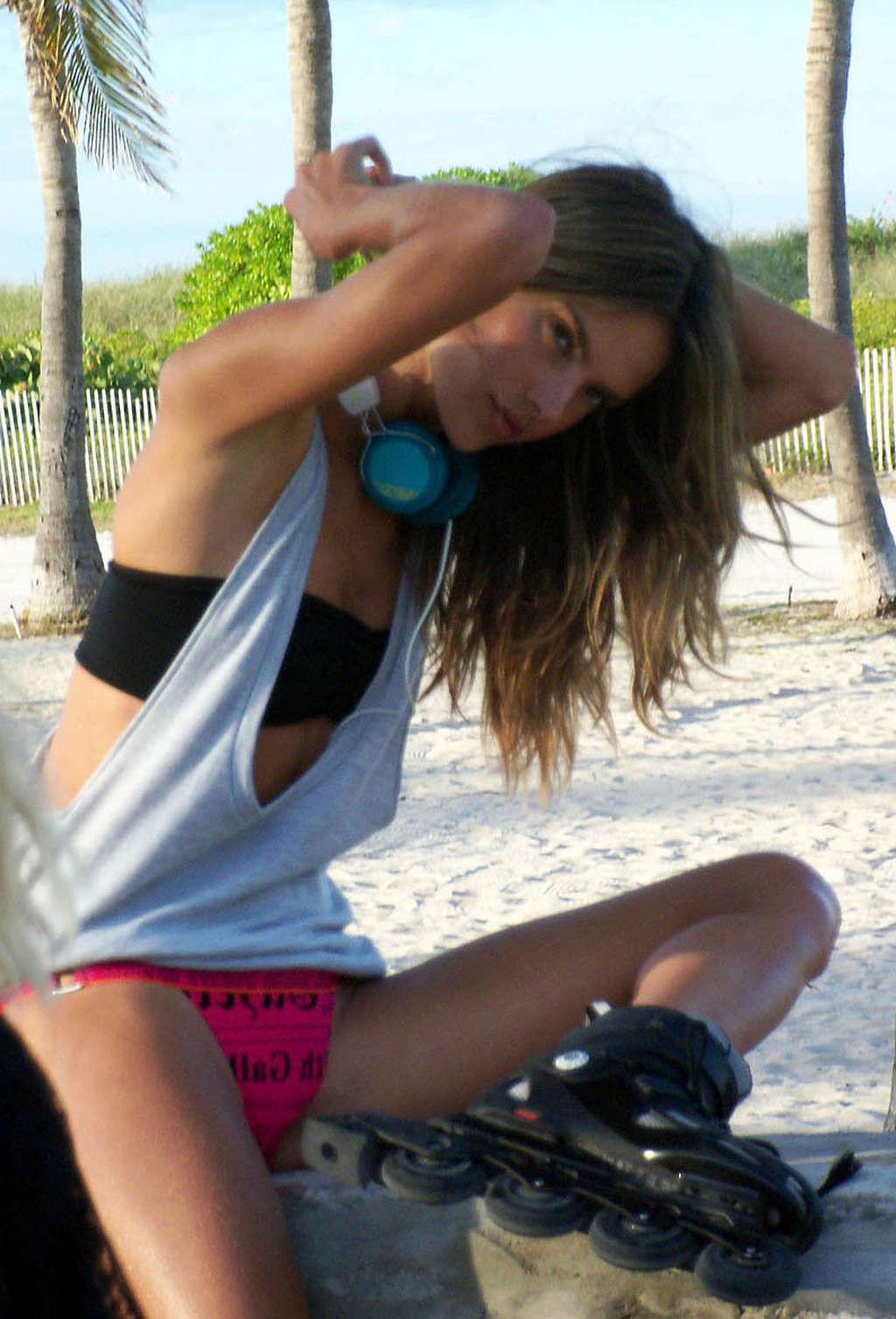 16P Alessandra Ambrosio posing with roller blades and upskirt in car