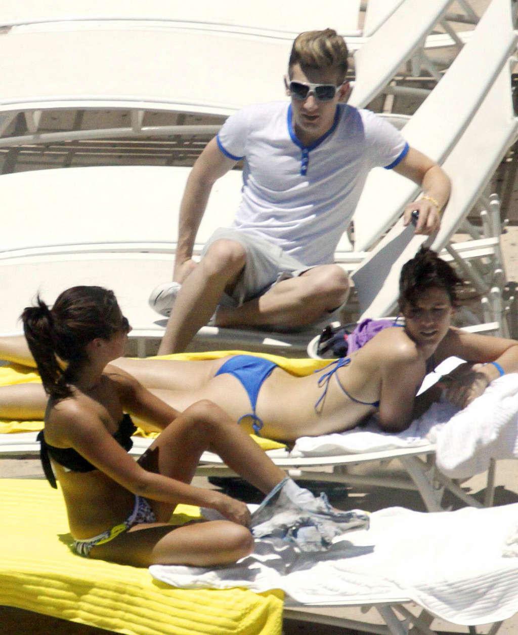 16P Ashley Tisdale in bikini relaxes poolside at her Miami hotel with friends