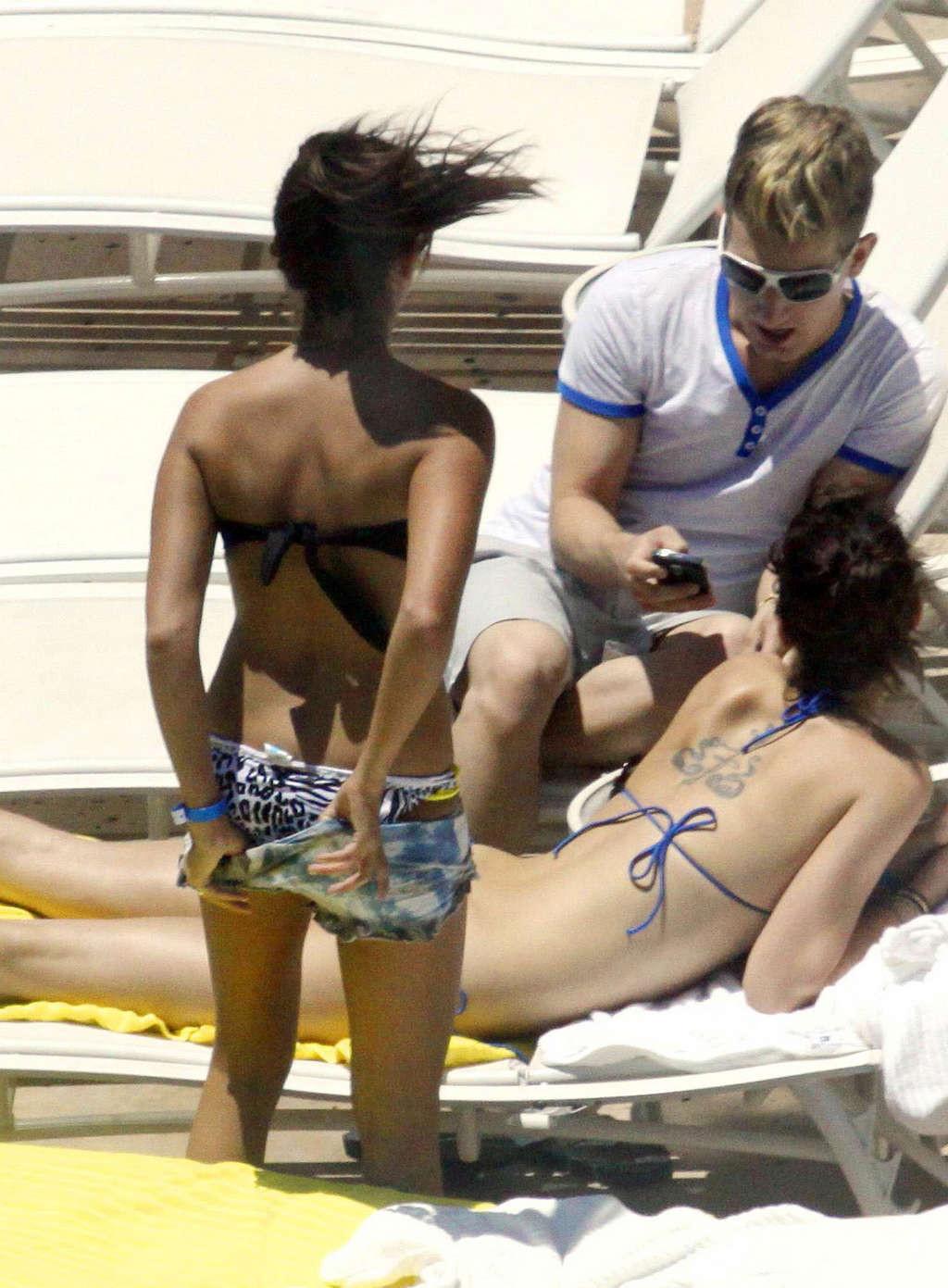 16P Ashley Tisdale in bikini relaxes poolside at her Miami hotel with friends