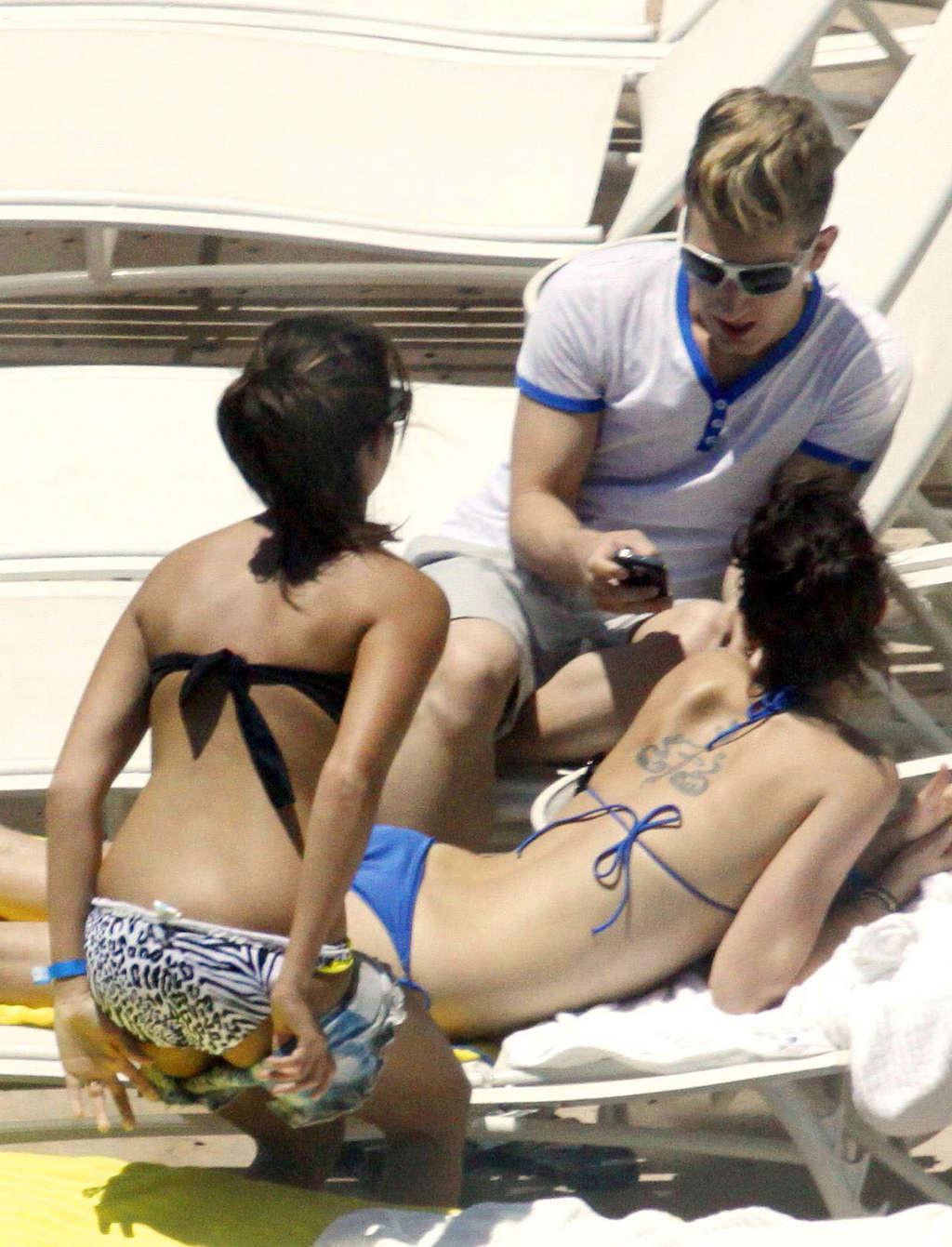 16P Ashley Tisdale in bikini relaxes poolside at her Miami hotel with friends