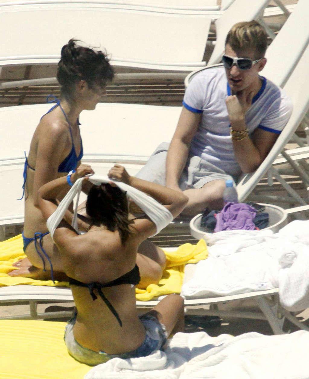 16P Ashley Tisdale in bikini relaxes poolside at her Miami hotel with friends