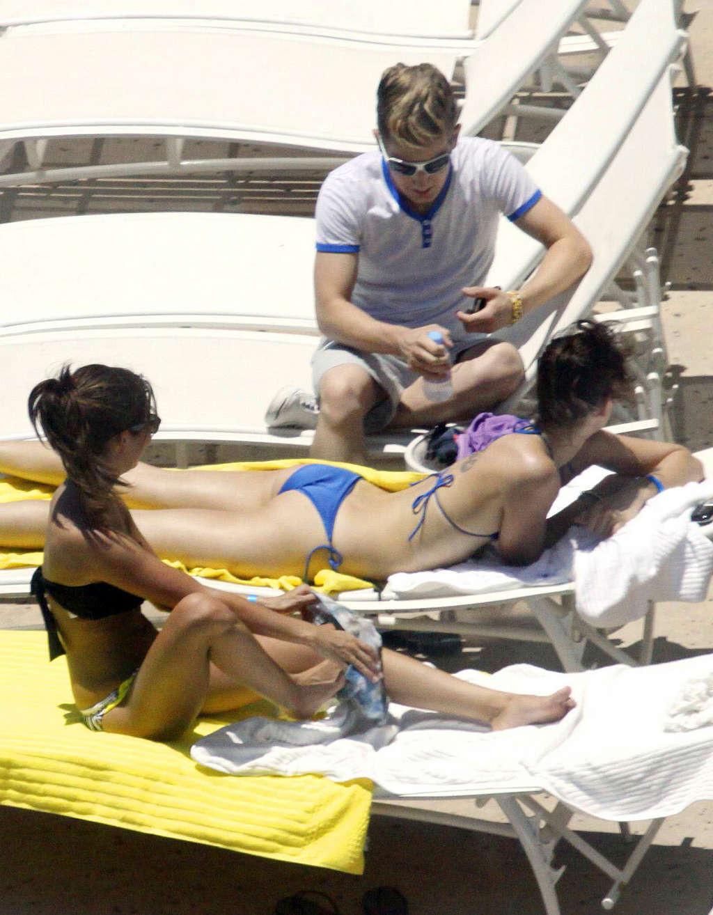 16P Ashley Tisdale in bikini relaxes poolside at her Miami hotel with friends