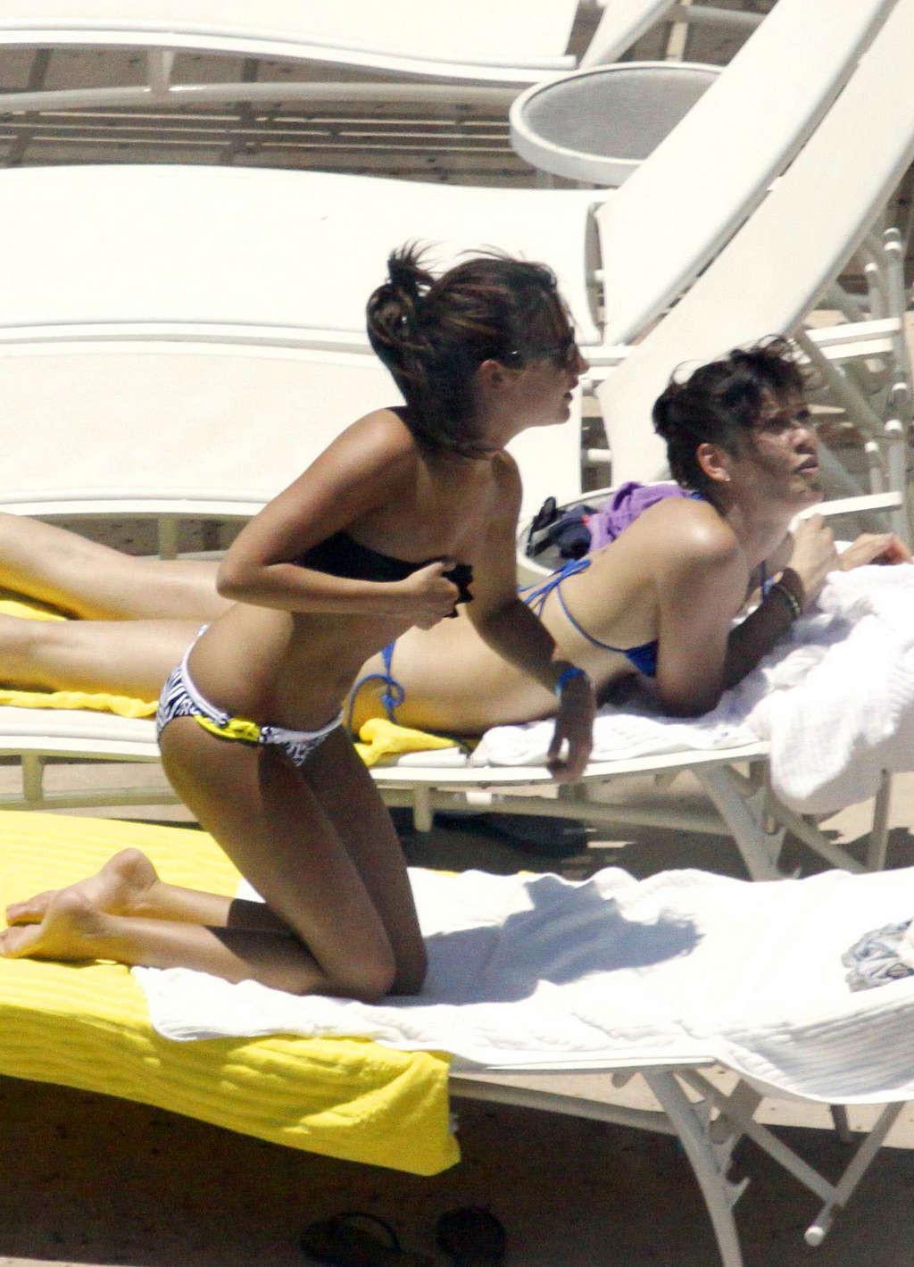 16P Ashley Tisdale in bikini relaxes poolside at her Miami hotel with friends