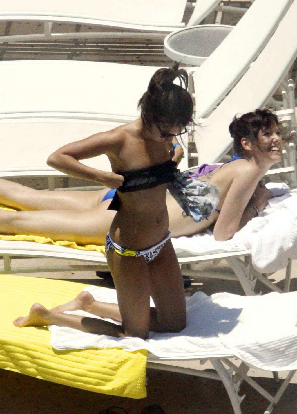 16P Ashley Tisdale in bikini relaxes poolside at her Miami hotel with friends