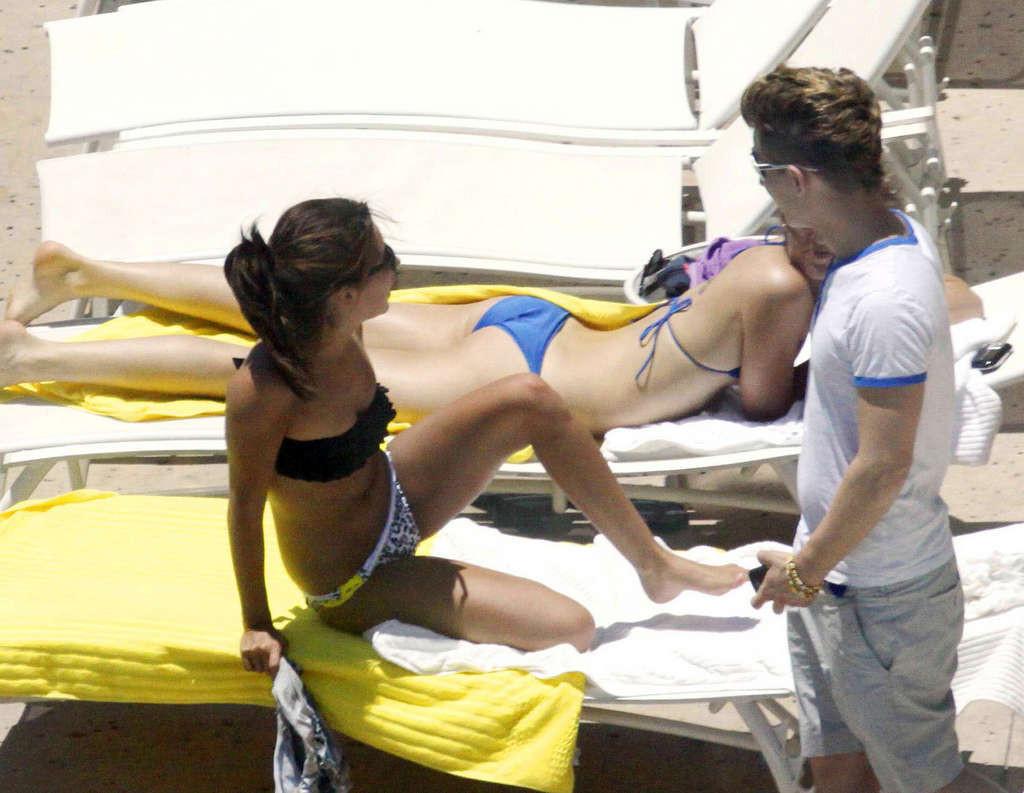 16P Ashley Tisdale in bikini relaxes poolside at her Miami hotel with friends