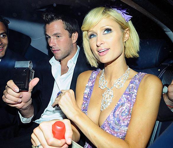 10P Paris Hilton exposing her panties upskirt in car paparazzi pictures and her nice