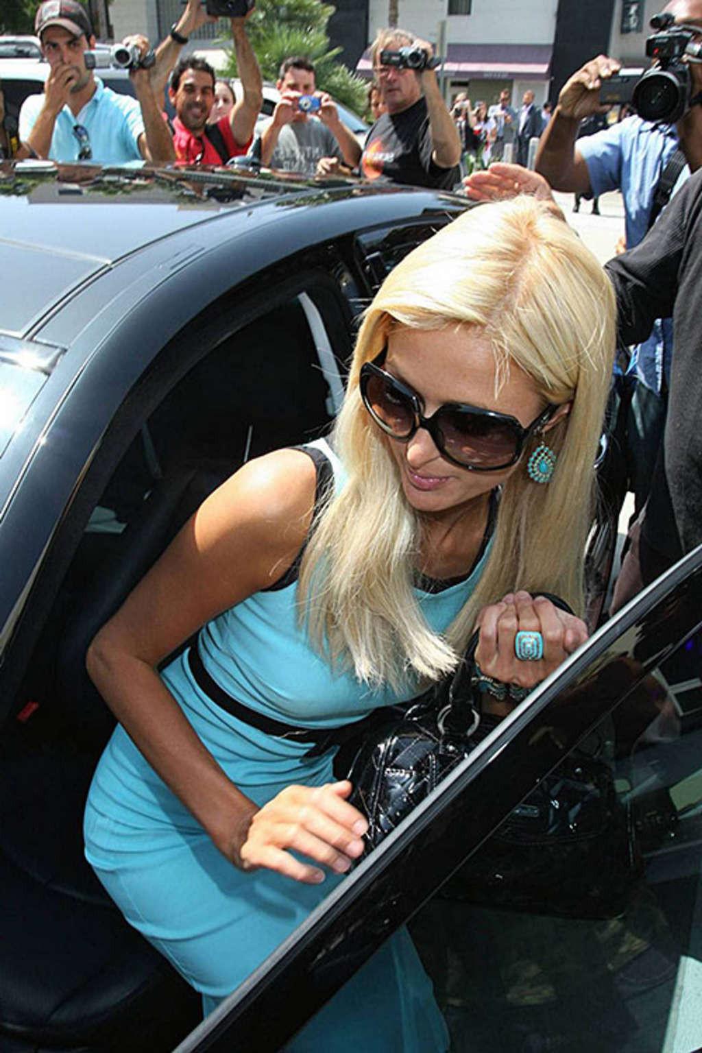 10P Paris Hilton exposing her panties upskirt in car paparazzi pictures and her nice