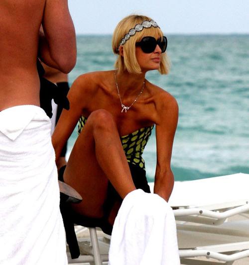 16P Paris Hilton tits slip and pussy exposed upskirt in car paparazzi pictures