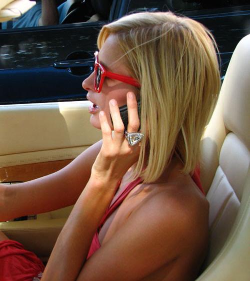 16P Paris Hilton showing her nice shaved pussy in car