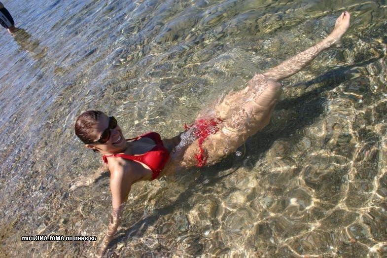 10P Amateur slim chick posing in her red bikini outdoors