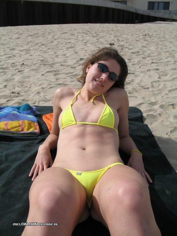 10P Collection of a slim brunette posing in her yellow bikini