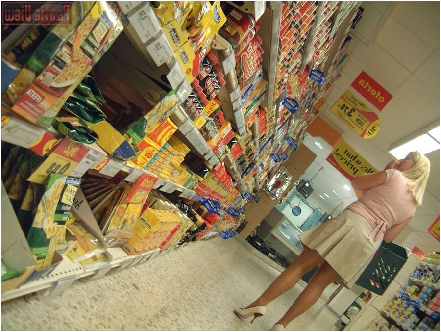 15P Upskirt girl in shop showing here black panties under pantyhose