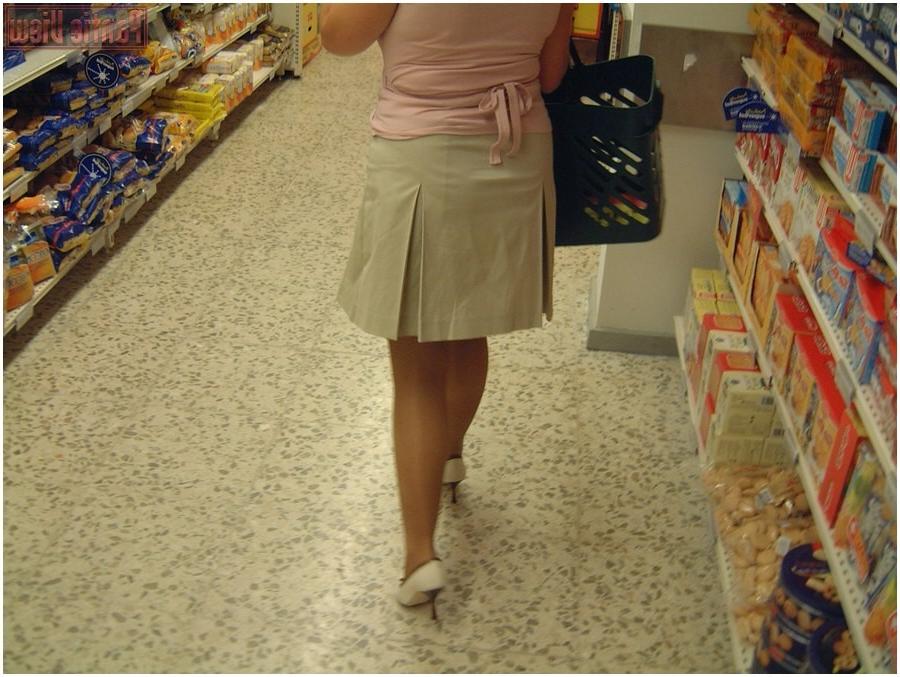 15P Upskirt girl in shop showing here black panties under pantyhose