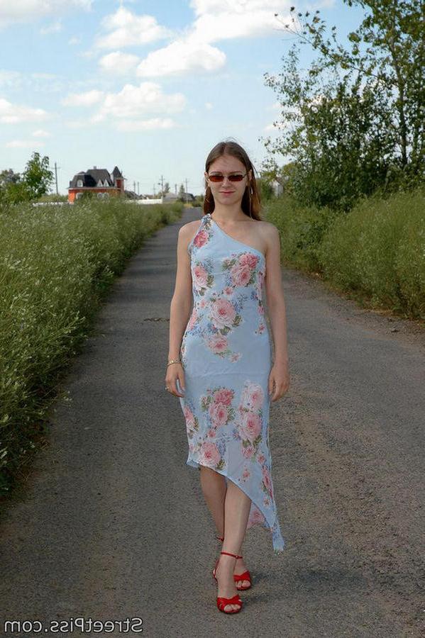 12P Hot chick in high heels squats down on a country road