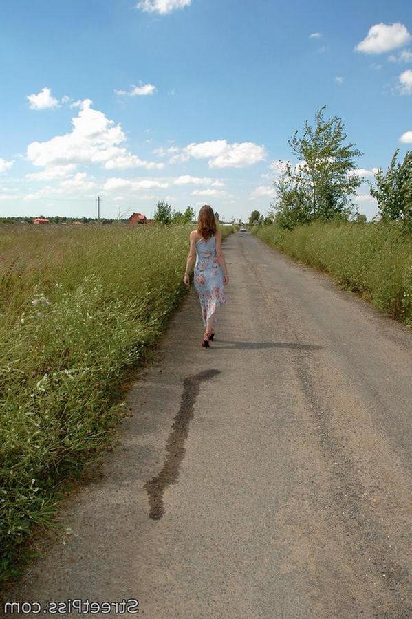 12P Hot chick in high heels squats down on a country road