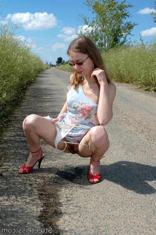 12P Hot chick in high heels squats down on a country road