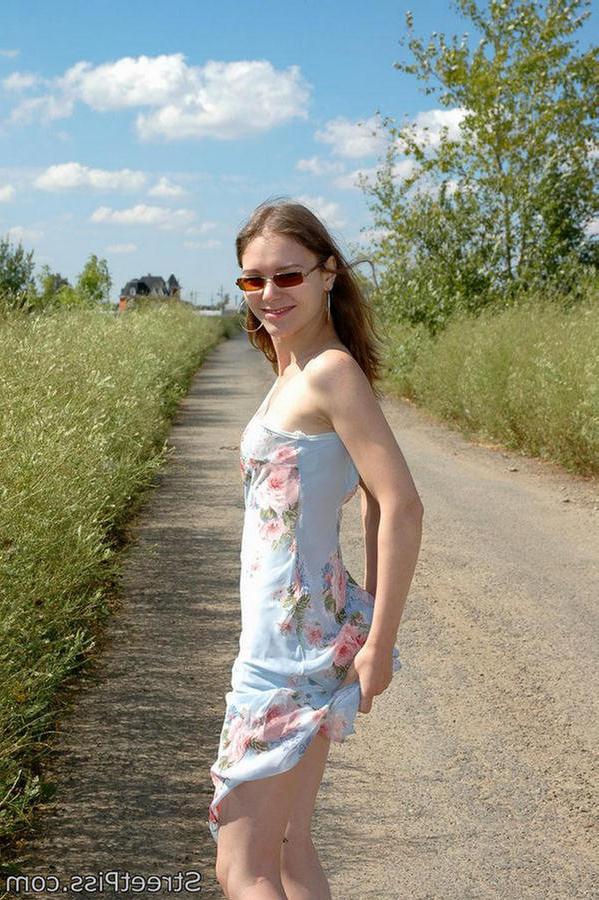 12P Hot chick in high heels squats down on a country road