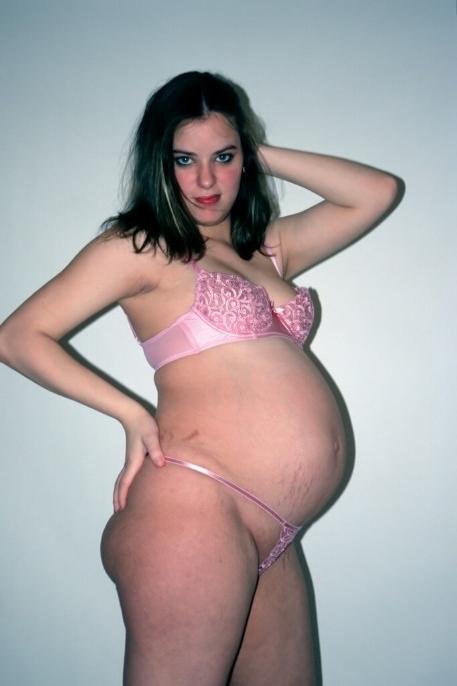 15P Girl showing her big pregnant belly