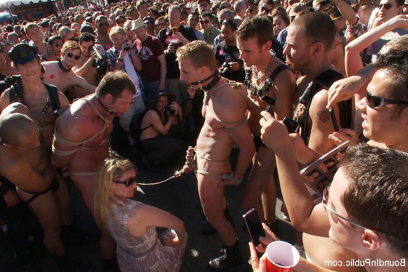 15P A sexy stud is stripped naked, humiliated and gang fucked in front of a cheerin