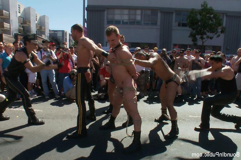15P A sexy stud is stripped naked, humiliated and gang fucked in front of a cheerin